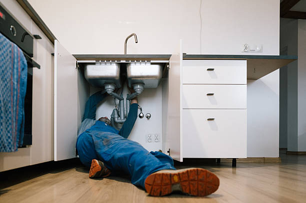Professional Emergency Plumber technician working in Hopwood, PA